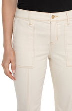 Load image into Gallery viewer, Close-up of model wearing tan denim and black top against a white background.