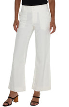 Load image into Gallery viewer, Experience ultimate comfort and style with our Hannah Flare Eco Jean in Soft White. Carefully crafted from premium soft denim, these jeans provide a luxurious and cozy feel. The classic flare silhouette adds a vintage touch to your outfit, while the utility stitched pockets combine fashion and function.