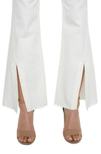 Load image into Gallery viewer, One of our favorite jeans this season, designed with vintage-like characteristics to give a rigid look while keeping comfort in mind. A high waisted silhouette, slim fit and flared leg offers a sleek and elongating look. A flattering twisted side slit at the hem take this jean to a new level! Dress it up with a beautiful blouse and heels or down with a classic tee and sneakers. 