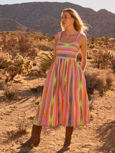 Load image into Gallery viewer, The Nic & Zoe Heat Wave Sadie Dress is a vibrant pink multi pastel fit-and-flare dress with wide straps, a round neckline, and a smocked back for a comfortable fit. Crafted from a lightweight polyester-cotton blend, it features side seam pockets for added practicality. Perfect for warm-weather outings, this dress combines effortless style with everyday wearability.