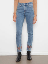 Load image into Gallery viewer, Model wearing a brown knit top, blue jeans with embroidered hem and black boots against a grey background.