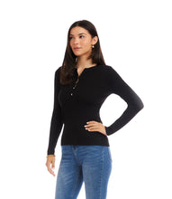 Load image into Gallery viewer, Woman wearing a black long-sleeve sweater and blue jeans against a white background.