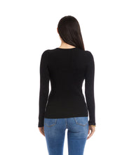 Load image into Gallery viewer, Woman wearing a black long-sleeve sweater and blue jeans against a white background.