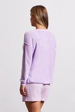 Load image into Gallery viewer, One of our top sellers, this light and adaptable V-neck sweater is a perfect choice for casual, trendy fashion. Our gorgeous sweater offers a stunning light purple color, pop-over design and long sleeves with drop shoulders, an exposed center seam, and a high-low hem with side-slit details. Color - Iris. Pop-over v-neck. Long sleeve with drop shoulder Exposed center seam; high-low hem with side slits Special reverse bleach print Fabric - 100% Cotton.