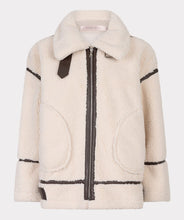 Load image into Gallery viewer, The luxurious Faux Fur Aviator Jacket in creamy ivory is a fashion statement. It boasts a plush faux fur exterior, complemented by dark brown leather accents and an elegant buckle detail for extra style. The inside is made of velvety suede that adds extra warmth. Designed with long sleeves and a zip-up closure, it's not only chic but also practical, ensuring warmth and fashion throughout the cooler seasons.