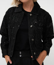 Load image into Gallery viewer, Model wearing a black sequin jacket over a black tee and black pants against a white background.