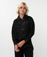 Load image into Gallery viewer, Woman wearing a black sequin jacket, black pants and silver hoop earrings against a white background.