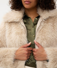 Load image into Gallery viewer, The Short Hairy Jacket is a stylish and warm garment. It boasts a plush faux fur exterior, a zip-up front, and a boxy, cropped silhouette. Crafted from 100% polyester, the jacket is soft to the touch and cozy, ideal for elevating your autumn and winter wardrobe. Combine it with a beloved blouse, skirt, and boots for an effortlessly fashionable ensemble.