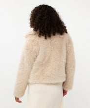 Load image into Gallery viewer, The Short Hairy Jacket is a stylish and warm garment. It boasts a plush faux fur exterior, a zip-up front, and a boxy, cropped silhouette. Crafted from 100% polyester, the jacket is soft to the touch and cozy, ideal for elevating your autumn and winter wardrobe. Combine it with a beloved blouse, skirt, and boots for an effortlessly fashionable ensemble.