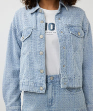 Load image into Gallery viewer, The Druna Distressed Jean Jacket by EsQualo features a light blue color and distressed denim quality. It is equipped with front pockets and adorned with rhinestone-encrusted buttons, giving it a touch of elegance. The texture almost resembles a boucle fabric.