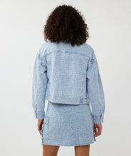Load image into Gallery viewer, The Druna Distressed Jean Jacket by EsQualo features a light blue color and distressed denim quality. It is equipped with front pockets and adorned with rhinestone-encrusted buttons, giving it a touch of elegance. The texture almost resembles a boucle fabric.