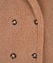 Load image into Gallery viewer, Wrap yourself in a stylish jacket that feels like a teddy bear hug. Our Teddy jacket is a stylish and cozy oversized piece. It boasts four buttons and trendy stitching details on the trim. Not only is this jacket fashionable, but it's also warm, making it an ideal choice for your autumn collection.