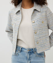 Load image into Gallery viewer, Our Janny Jacket Tweed by EsQualo is a stunning piece that combines elegance and casual chic. The exquisite blue and off-white tweed fabric is elevated with shimmering gold lurex details, making it a sophisticated choice for any occasion. Designed with practical chest pockets and adorned with beautiful gold buttons, this jacket is both stylish and functional. Perfect for pairing with dressy trousers or casual jeans, it’s an effortless way to refine your look.