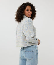 Load image into Gallery viewer, Our Janny Jacket Tweed by EsQualo is a stunning piece that combines elegance and casual chic. The exquisite blue and off-white tweed fabric is elevated with shimmering gold lurex details, making it a sophisticated choice for any occasion. Designed with practical chest pockets and adorned with beautiful gold buttons, this jacket is both stylish and functional. Perfect for pairing with dressy trousers or casual jeans, it’s an effortless way to refine your look.