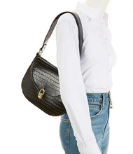 Load image into Gallery viewer, The Jacqueline is an ideal shoulder bag for any event. It is designed with high-grade vegan leather and adjustable vegan leather strap. The turn-lock closure and flap opening provide secure storage for items. Color- Black. Turn lock flap closure. Side pocket and zip closure inside. Adjustable strap. Vegan leather. Vegan leather strap. Measurements-10.5" x 1.5" x 9."