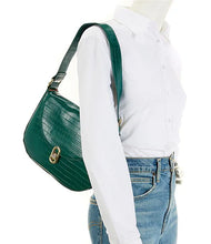 Load image into Gallery viewer, The Jacqueline is an ideal shoulder bag for any event. It is designed with high-grade vegan leather and adjustable vegan leather strap. The turn-lock closure and flap opening provide secure storage for items. Color- Emerald green. Turn lock flap closure. Side pocket and zip closure inside. Adjustable strap. Vegan leather. Vegan leather strap.