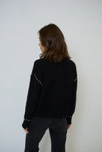 Load image into Gallery viewer, Woman wearing a black jacket with silver stud embellishments and black pants against a white background.