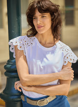 Load image into Gallery viewer, The Lyssé Katarina Eyelet Sleeve Trim Top is a refined yet effortless short-sleeve blouse featuring delicate eyelet-trimmed sleeves for a touch of elegance. Designed with a relaxed silhouette, this top offers both comfort and sophistication, making it a versatile addition to any wardrobe.