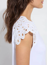 Load image into Gallery viewer, The Lyssé Katarina Eyelet Sleeve Trim Top is a refined yet effortless short-sleeve blouse featuring delicate eyelet-trimmed sleeves for a touch of elegance. Designed with a relaxed silhouette, this top offers both comfort and sophistication, making it a versatile addition to any wardrobe.