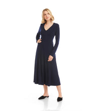 Load image into Gallery viewer, Woman wearing a navy blue dress and navy flats against a white background.