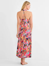 Load image into Gallery viewer, Woman wearing a bright red multicolor sleeveless dress against a white background.