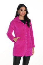 Load image into Gallery viewer, A woman wearing a bright fuchsia pink eyelash knit jacket with a collar, button-down front, and functional pockets.