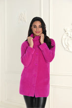 Load image into Gallery viewer, A woman wearing a bright fuchsia pink eyelash knit jacket with a collar, button-down front, and functional pockets.