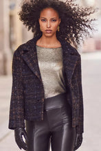 Load image into Gallery viewer, Woman wearing a navy and copper jacket over a sparkly top and black pants, standing outdoors.