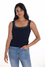 Load image into Gallery viewer, The Kiera Knit Sleeveless Top in deep navy is a sophisticated addition to any collection, featuring delicate crystal embellishments at the neckline and straps that add a touch of refined glamour. Designed by Frank Lyman, this piece boasts a flattering sleeveless cut and soft knit fabric for effortless comfort and chic versatility. Perfect for both formal occasions and elevated casual styling, it pairs beautifully with tailored pants or statement skirts.