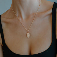 Load image into Gallery viewer, Model wearing a black tank with a gold pendant necklace featuring Virgin Mary with cubic zirconia accents.