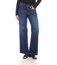 Load image into Gallery viewer, Model wearing blue jeans with patch pockets, black top and black sandals against a white background.