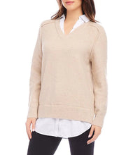 Load image into Gallery viewer, Woman wearing a layered beige sweater and black pants against a white background.