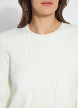 Load image into Gallery viewer, Crafted from cozy jacquard, the Leanna Cozy Pearl Sweater features strategically placed cables on the front and sleeves, a crew neck, and a square, cropped fit. White pearls are hand-stitched between the cables on the sleeves employing a gradient effect. You will feel and look fabulous when styling this top with any of your favorite bottoms.