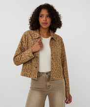 Load image into Gallery viewer, Woman wearing a leopard print jacket over a white shirt and beige pants against a light gray background.