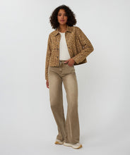 Load image into Gallery viewer, Woman wearing a leopard print jacket and beige pants against a white background.