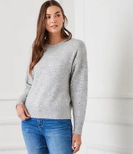 Load image into Gallery viewer, Experience warmth and elegance this winter with our light heather gray pearl crewneck sweater. Adorned with pearl details on the front and arms, this cozy and chic garment is suitable for any event. From formal occasions to casual outings, this sweater is sure to receive admiration.