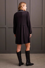 Load image into Gallery viewer, The Lucinda dress combines elegance with convenience, offering generous pockets that merge style with functionality. It showcases a refined v-neckline, complemented by a collar with intricate blanket stitch detailing, sophisticated long sleeves with elasticized cuffs, and a 36" length that gracefully falls just above the knee. This exquisite garment is crafted from superior lightweight ponte fabric.