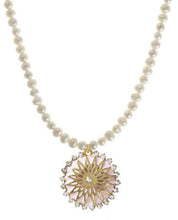Load image into Gallery viewer, Elevate your jewelry collection with the TOVA Lily Necklace, a stunning statement piece designed to add effortless glamour to any outfit. Crafted with high-quality materials, this necklace features a round pendant in light pink with a gold starburst center, surrounded by crystal embellishments that catch the light beautifully. Adding to the charm is the freshwater pearl chain which makes it perfect for both casual and formal occasions.