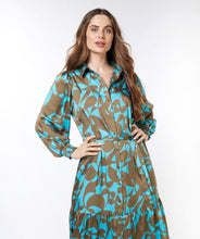 Load image into Gallery viewer, This Liva Long Expressive Roots Dress by EsQualo offers a flattering fit with sophisticated details. The unique "Expressive Roots" print provides a sophisticated style for dressy and casual occasions. Elevate your look with complementary jewelry or complete the ensemble with a denim jacket. This dress is sure to become a treasured addition to your wardrobe. Color- Peacock blue and brown. Long sleeve. Collared. Button down. Tie waist.