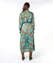 Load image into Gallery viewer, This Liva Long Expressive Roots Dress by EsQualo offers a flattering fit with sophisticated details. The unique "Expressive Roots" print provides a sophisticated style for dressy and casual occasions. Elevate your look with complementary jewelry or complete the ensemble with a denim jacket. This dress is sure to become a treasured addition to your wardrobe. Color- Peacock blue and brown. Long sleeve. Collared. Button down. Tie waist.