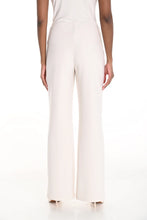 Load image into Gallery viewer, Close-up photo of woman wearing off-white wide leg pants and off-white heels against a white background.