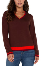 Load image into Gallery viewer, This long-sleeve sweater is the epitome of style, merging modern design with classic comfort seamlessly. It showcases striking color-block accents on the sleeves, neckline, back, and lower hem, lending a modern edge to the traditional shape. Made from a soft, cozy knit material, it's fashioned to provide warmth and fashion-forward appeal throughout the season.