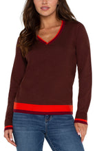 Load image into Gallery viewer, This long-sleeve sweater is the epitome of style, merging modern design with classic comfort seamlessly. It showcases striking color-block accents on the sleeves, neckline, back, and lower hem, lending a modern edge to the traditional shape. Made from a soft, cozy knit material, it's fashioned to provide warmth and fashion-forward appeal throughout the season.