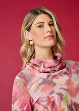 Load image into Gallery viewer, This cowl neck top combines a one-of-a-kind local artist's print with a draped neckline and fashionable pleated sleeves. This ultra soft, long-sleeve cowl neck top is the perfect garment for those in between days when a sweater is too heavy and lightweight options are not warm enough. It adds a touch of sophistication and artistic flair to any wardrobe and is incredibly versatile.
