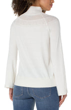 Load image into Gallery viewer, This timeless sweater is a classic blend of style and comfort. Crafted from a luxurious fabric in a porcelain white, with intricate pointelle stitching, it features a funnel neck and bell sleeves. Perfect for layering or wearing solo, it's a wardrobe essential. Color- Porcelain. Sweater yarn fabrication. Mock neckline. Bell sleeves. Pointelle detailing. Pullover construction.