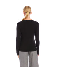 Load image into Gallery viewer, Person wearing a black long-sleeve top and plaid pants on a white background.