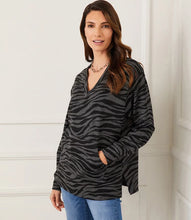 Load image into Gallery viewer, Experience ultimate comfort and warmth in our cozy zebra print long sleeve v-neck sweatshirt. Perfect for both leisurely days and cooler weather, this top pairs effortlessly with leggings or denim for a casual yet stylish look.