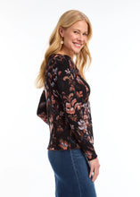 Load image into Gallery viewer, This long-sleeved V-neck top, adorned with a local artist's print, combines simplicity with style through its ribbed texture. It serves as a versatile piece for layering or as a standalone item. The scalloped hems at the bottom and cuffs enhance the design, and the colors are simply stunning.