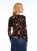 Load image into Gallery viewer, This long-sleeved V-neck top, adorned with a local artist's print, combines simplicity with style through its ribbed texture. It serves as a versatile piece for layering or as a standalone item. The scalloped hems at the bottom and cuffs enhance the design, and the colors are simply stunning.