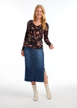 Load image into Gallery viewer, This long-sleeved V-neck top, adorned with a local artist's print, combines simplicity with style through its ribbed texture. It serves as a versatile piece for layering or as a standalone item. The scalloped hems at the bottom and cuffs enhance the design, and the colors are simply stunning.